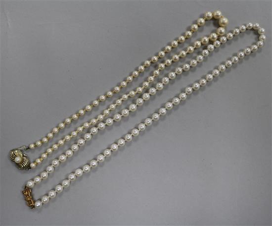 A single strand cultured pearl necklace with gold clasp and a simulated pearl necklace.